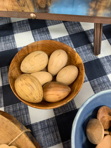 Wooden tops and eggs