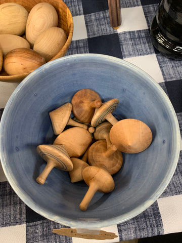 Wooden tops and eggs