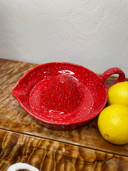 Red speckled citrus juicer